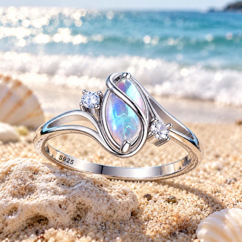 Oresa moonstone ring resting on sunlit coastal stone